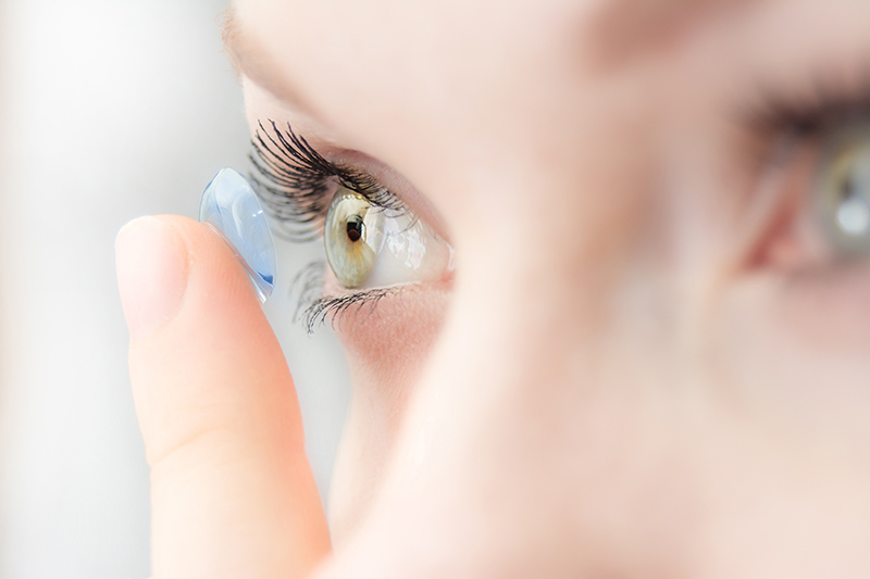 Woman wearing soft contact lens close up